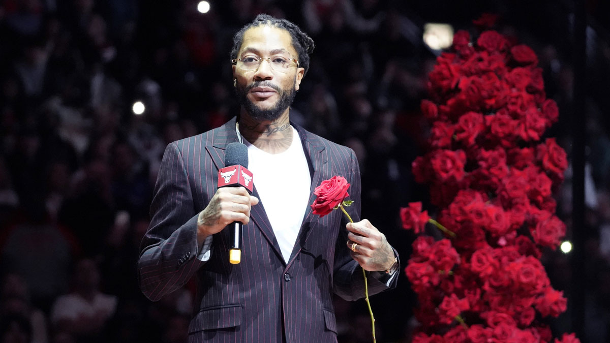 Chicago Bulls and New York Knicks former player Derrick Rose speaks as he is honored at halftime of a game between the Chicago Bulls and the New York Knicks at United Center.