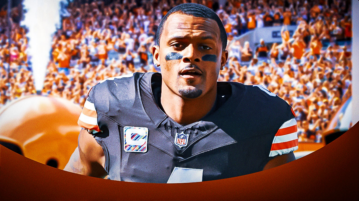 Browns Deshaun Watson sitting down on an NFL sideline looking upset/serious.