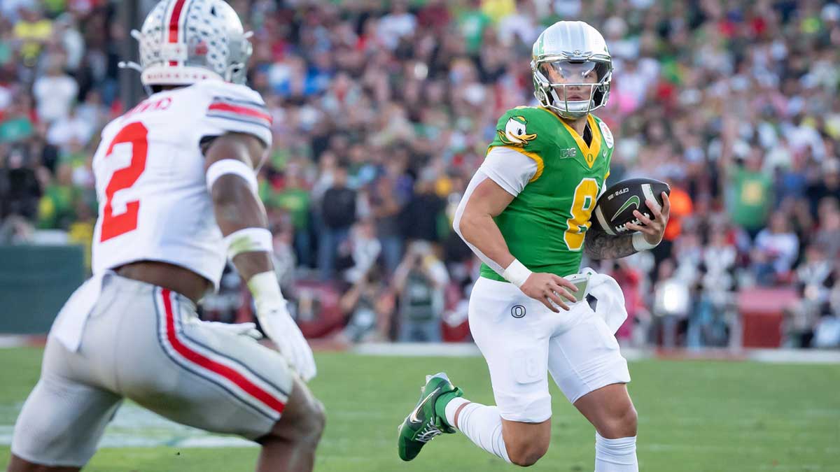 Oregon quarterback Dillon Gabriel scrambles with the ball as the Oregon Ducks face the Ohio State Buckeyes Wednesday, Jan. 1, 2025, in the quarterfinal of the College Football Playoff at the Rose Bowl in Pasadena, Calif.