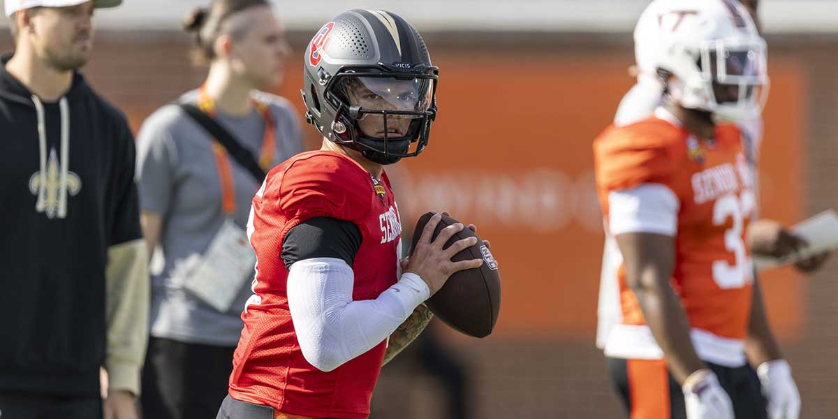 Jan 29, 2025; Mobile, AL, USA; National team quarterback Dillon Gabriel of Oregon (8) drops to pass during Senior Bowl practice for the National team at Hancock Whitney Stadium. Mandatory Credit: Vasha Hunt-Imagn Images