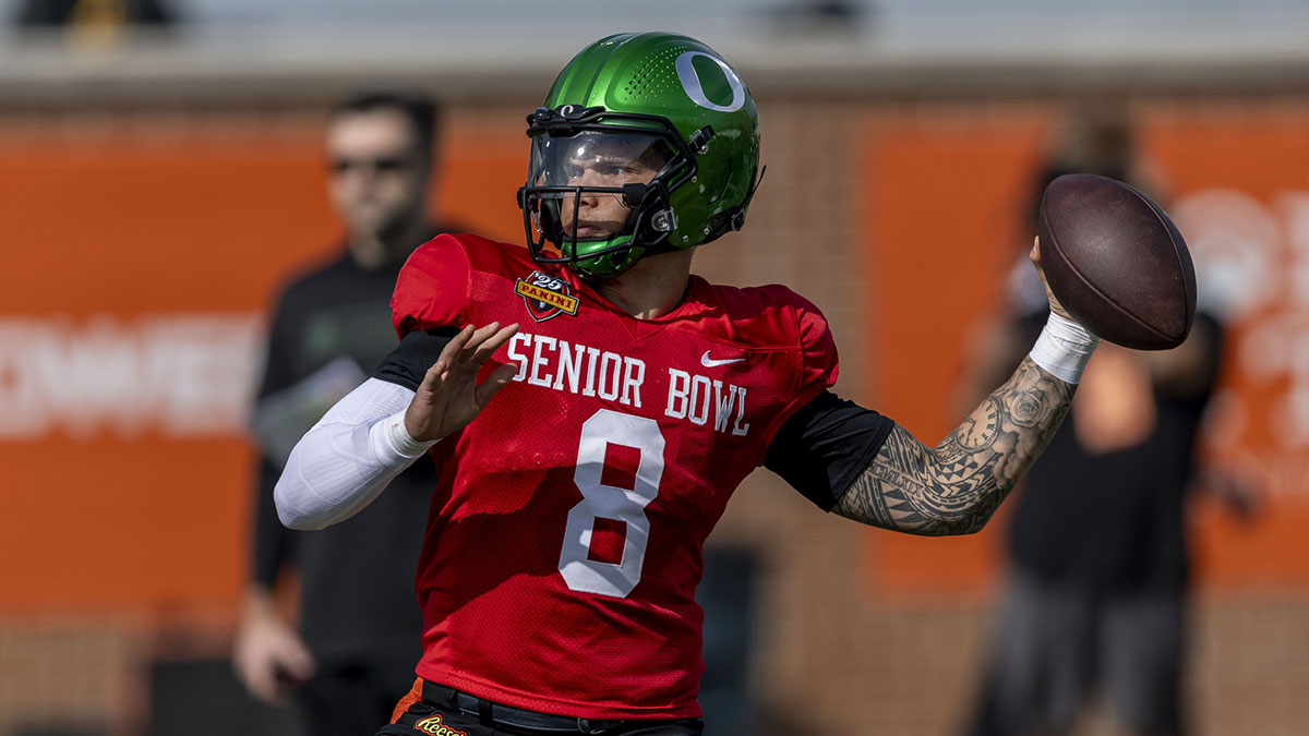 Jan 28, 2025; Mobile, AL, USA; National team quarterback Dillon Gabriel of Oregon (8) throws the ball during Senior Bowl practice for the National team at Hancock Whitney Stadium.