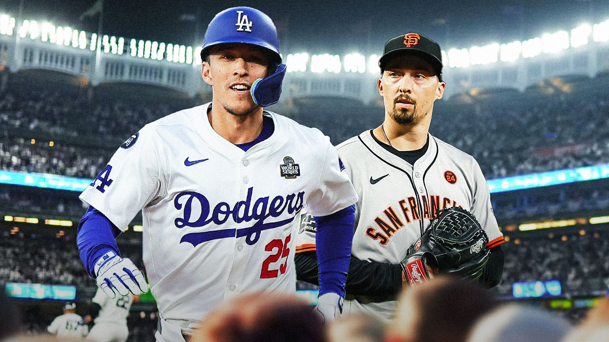 Tommy Edman next to Blake Snell (Giants) in front of the Dodgers stadium.