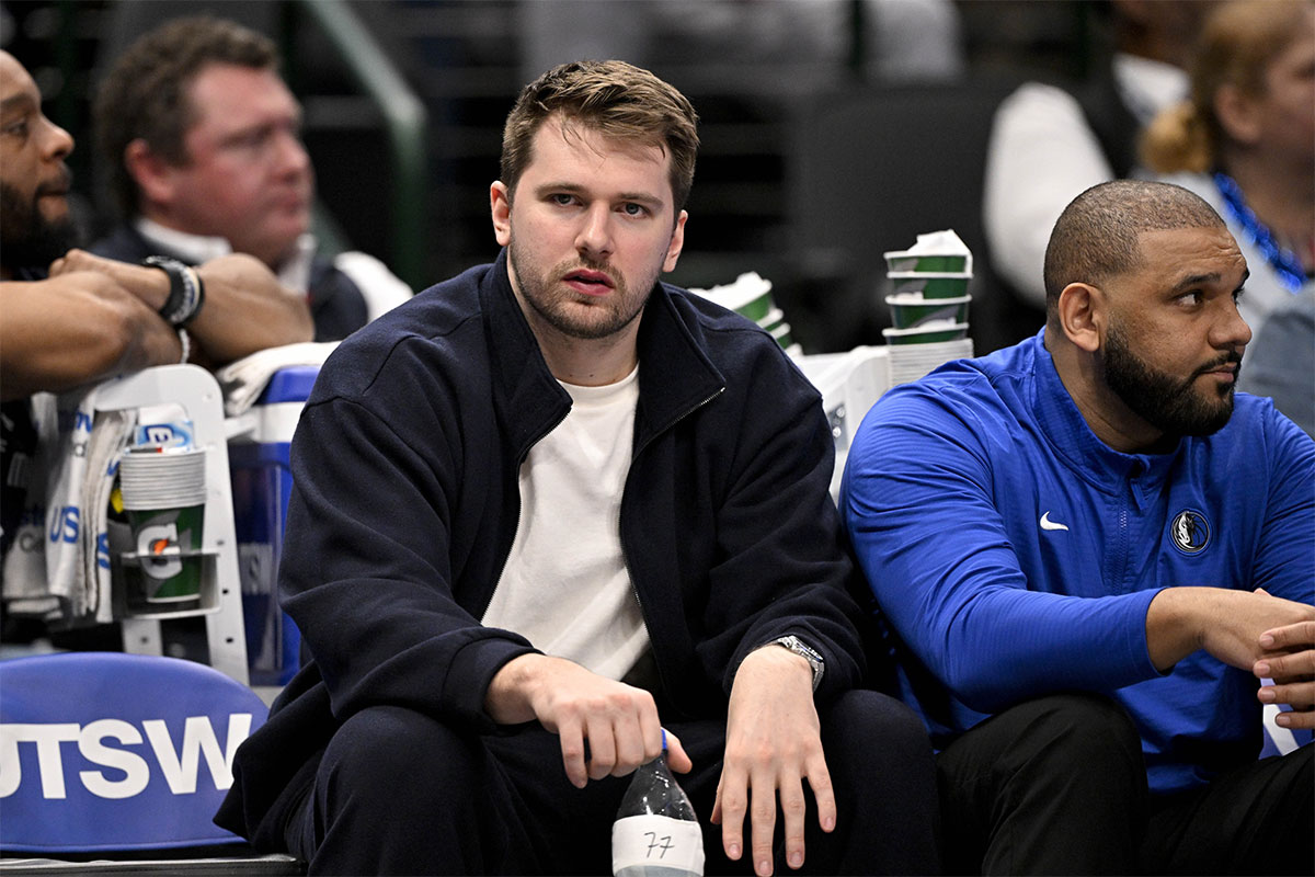 Dallas Mavericks guard Luka Doncic (77) reacts from the team's bench during the second half of the game against the Denver Nuggets at American Airlines Center.