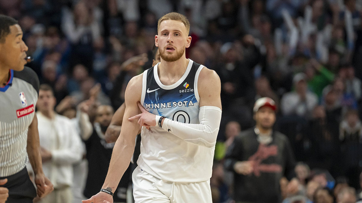 Minnesota Timberwolves guard Donte DiVincenzo (0) celebrates after making a shot against the San Antonio Spurs in the second half at Target Center.