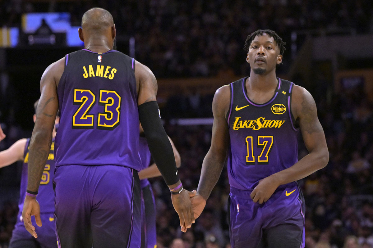 Los Angeles Lakers forward Dorian Finney-Smith (17) goes in for forward LeBron James (23) in the first half against the Portland Trail Blazers at Cripto.com Arena.