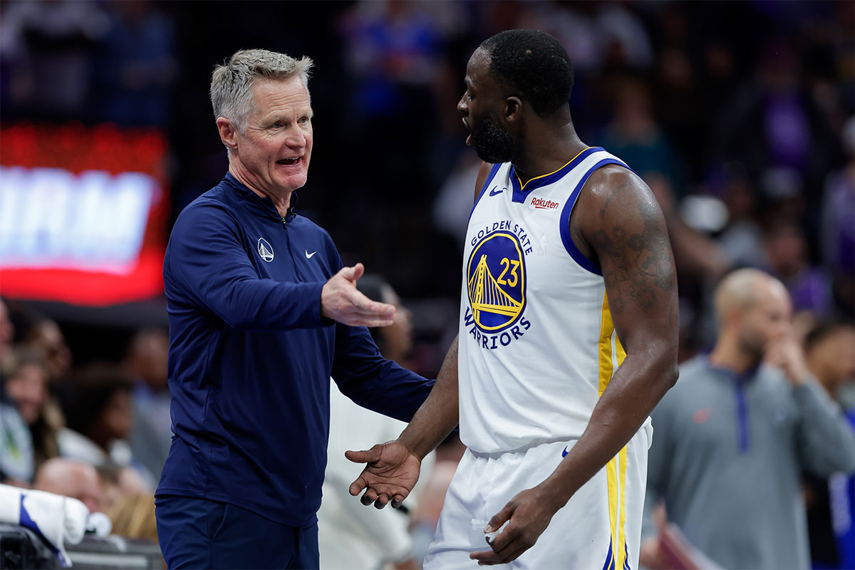 Golden State Warriors forward Draymond Green (23) talks with head coach Steve Kerr during the fourth quarter against the Sacramento Kings at Golden 1 Center.