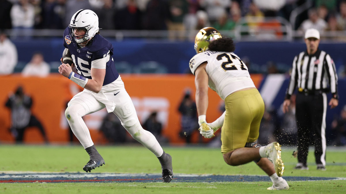 Jan 9, 2025; Miami, FL, USA; Penn State Nittany Lions quarterback Drew Allar (15) runs the ball in the second half against the Notre Dame Fighting Irish in the Orange Bowl at Hard Rock Stadium. Mandatory Credit: Nathan Ray Seebeck-Imagn Images