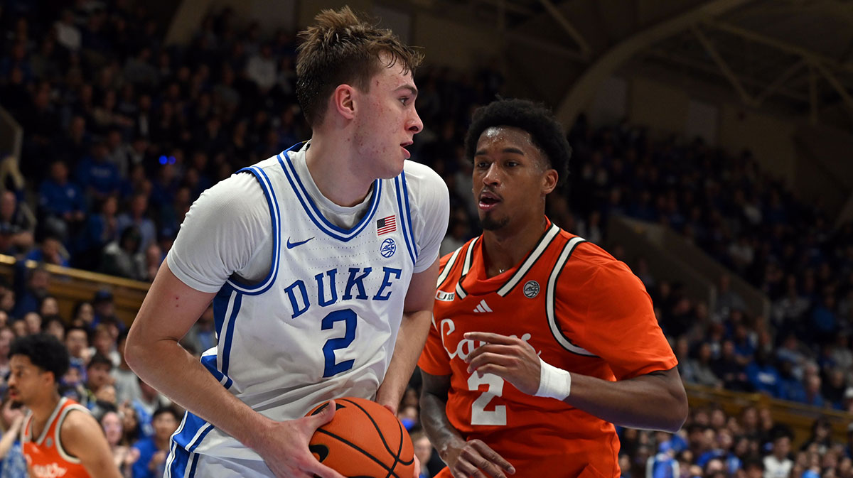 Duke Blue Devils forward Cooper Flagg (2) looks to pass as Miami Hurricanes forward Brandon Johnson (2) defends during the second half at Cameron Indoor Stadium.
