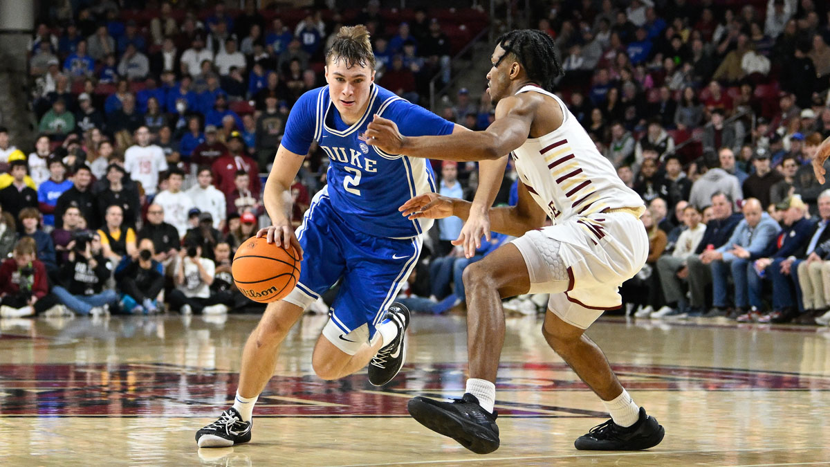 Duke Blue Devils guard Cooper Flagg (2) dribbles the ball against Boston College Eagles guard Donald Hand Jr. (13) during the second half at Conte Forum.