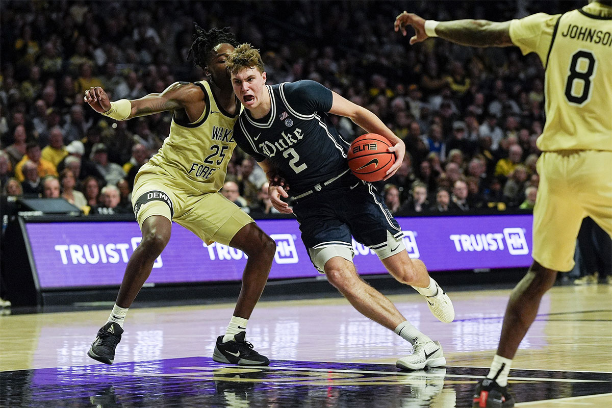 Duke Blue Devils guard Cooper Flagg (2) drives to the basket against Wake Forest Demon Deacons forward Tre'Von Spillers (25) during the second half at Lawrence Joel Veterans Memorial Coliseum.