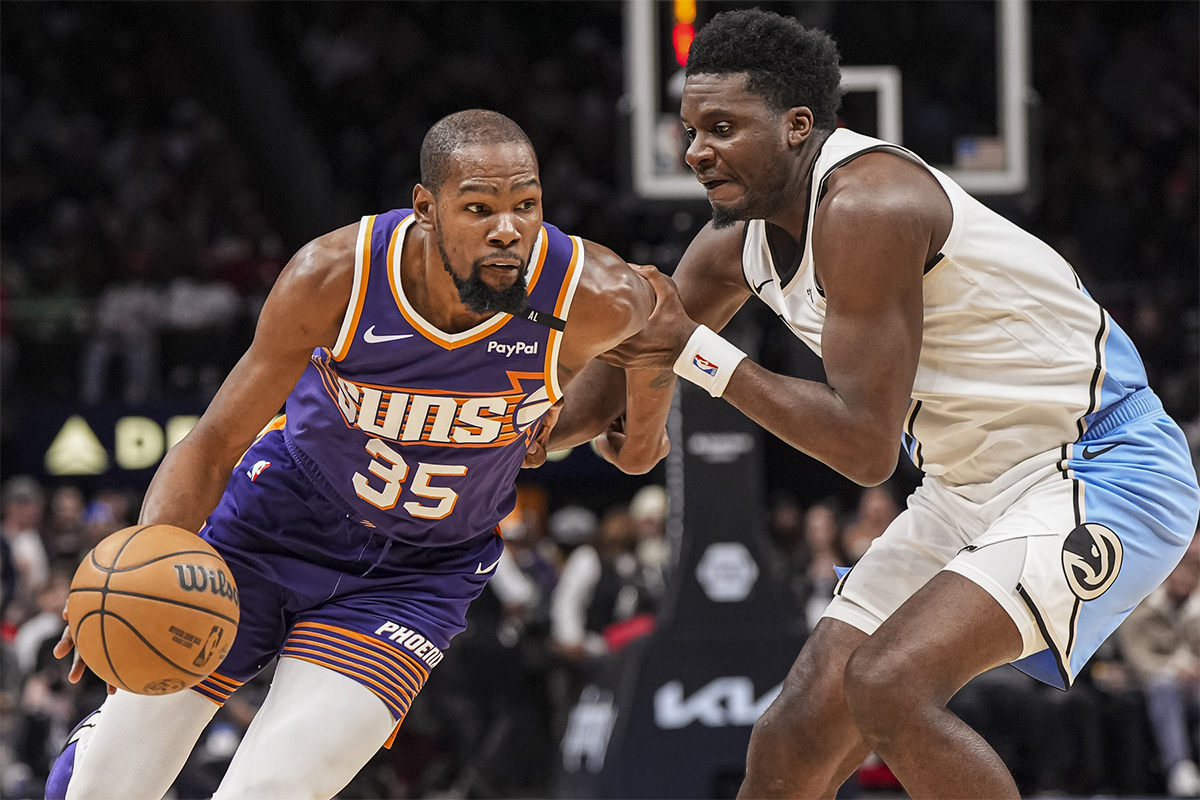 Phoenix Suns forward Kevin Durant (35) defends Atlanta Hawks center Clint Capela (15) during the second half at State Farm Arena.