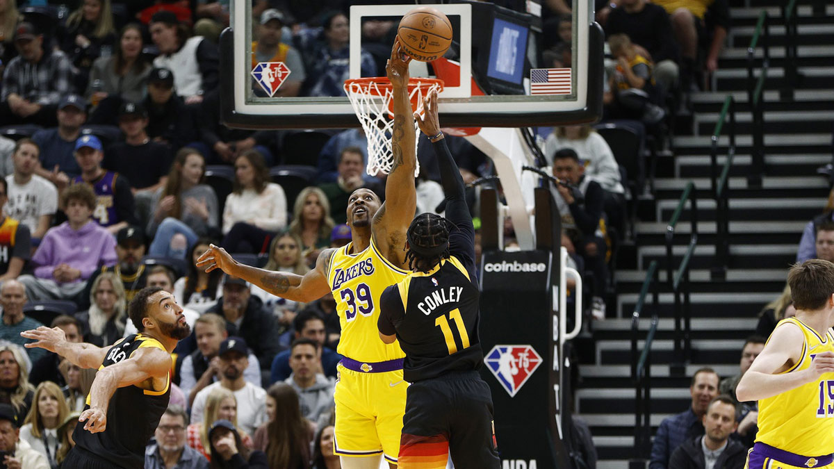 Los Angeles Lakers center Dwight Howard (39) blocks a shot by Utah Jazz guard Mike Conley (11) in the second quarter at Vivint Arena.