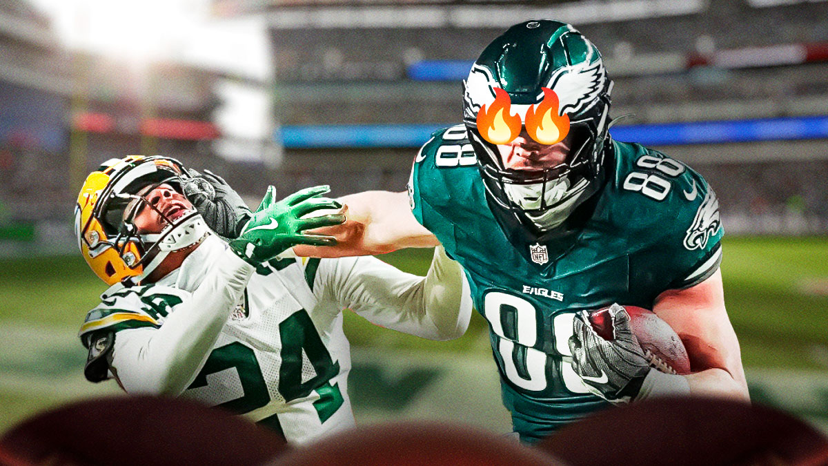Photo: Dallas Goedert smiling with fire in his eyes in Eagles jersey, have him stiff-arming Carrington Valentine as well