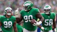 Philadelphia Eagles defensive tackle Jordan Davis (90) celebrate with teammates after his fumble recovery against the Dallas Cowboys during the second quarter at Lincoln Financial Field.