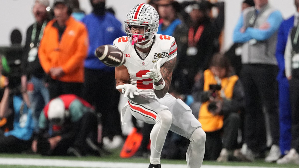 Ohio State Buckeyes wide receiver Emeka Egbuka (2) catches a pass against the Notre Dame Fighting Irish in the first half in the CFP National Championship college football game at Mercedes-Benz Stadium.