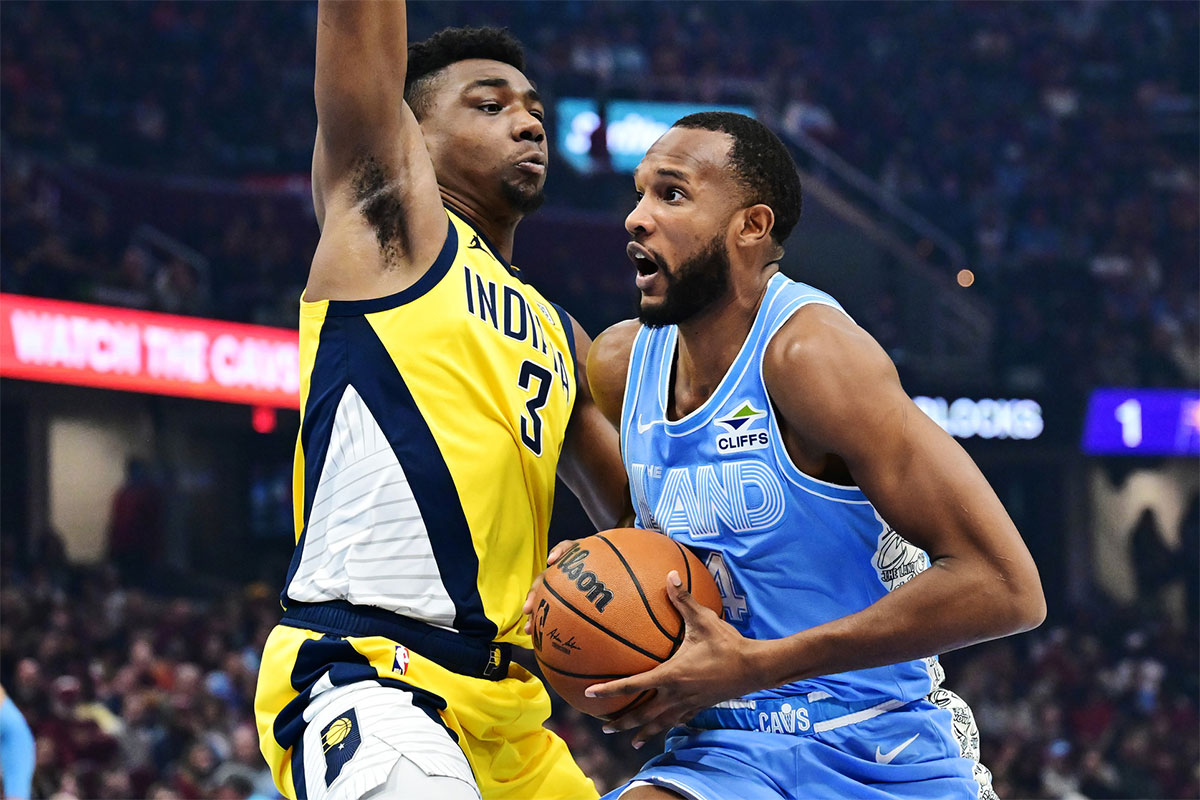 Cleveland Cavaliers forward Evan Mobley (4) drives to the basket against Indiana Pacers center Thomas Bryant (3) during the first half at Rocket Mortgage FieldHouse.