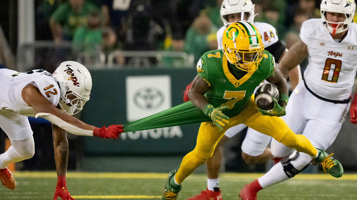 Oregon wide receiver Evan Stewart attempts to avoid a tackle from Maryland defensive back Dante Trader Jr. as the Oregon Ducks host the Maryland Terrapins at Autzen Stadium Saturday, Nov. 9, 2024 in Eugene, Ore.