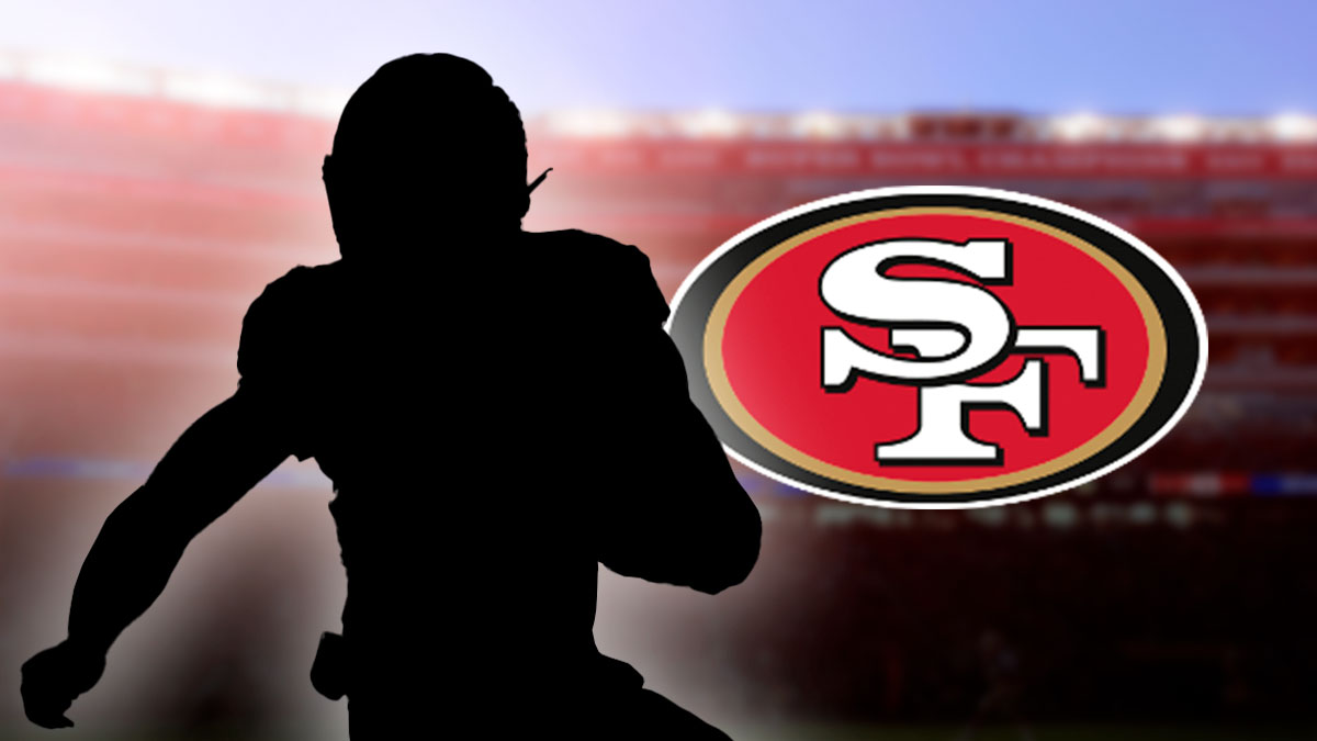 Dark silhouette of a football player running with the ball and a 49ers logo