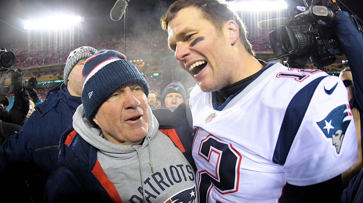 New England Patriots head coach Bill Belichick and quarterback Tom Brady (12) celebrate the win over the Kansas City Chiefs during overtime in the AFC Championship game at Arrowhead Stadium.