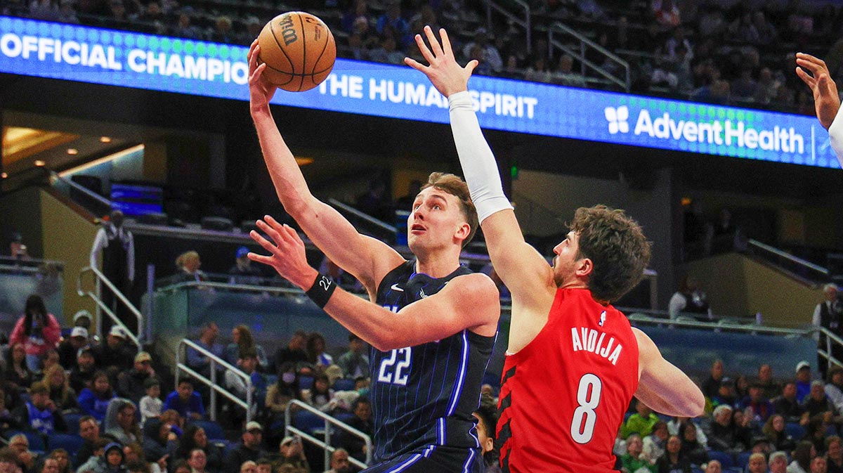 Orlando Magic forward Franz Wagner (22) goes to the basket against Portland Trail Blazers forward Deni Avdija (8) during the second quarter at Kia Center.