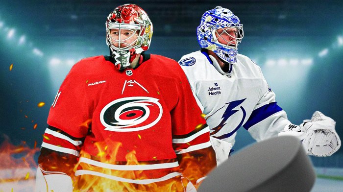 Frederik Andersen in image looking happy with fire around him, Andrei Vasilevskiy also in image looking happy, hockey rink in background