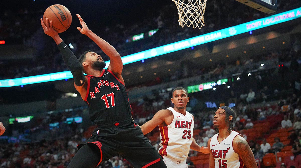 Toronto Raptors forward Garrett Temple (17) takes a shot as Miami Heat center Orlando Robinson (25) and guard Alondes Williams (15) defend during the second half at Kaseya Center.