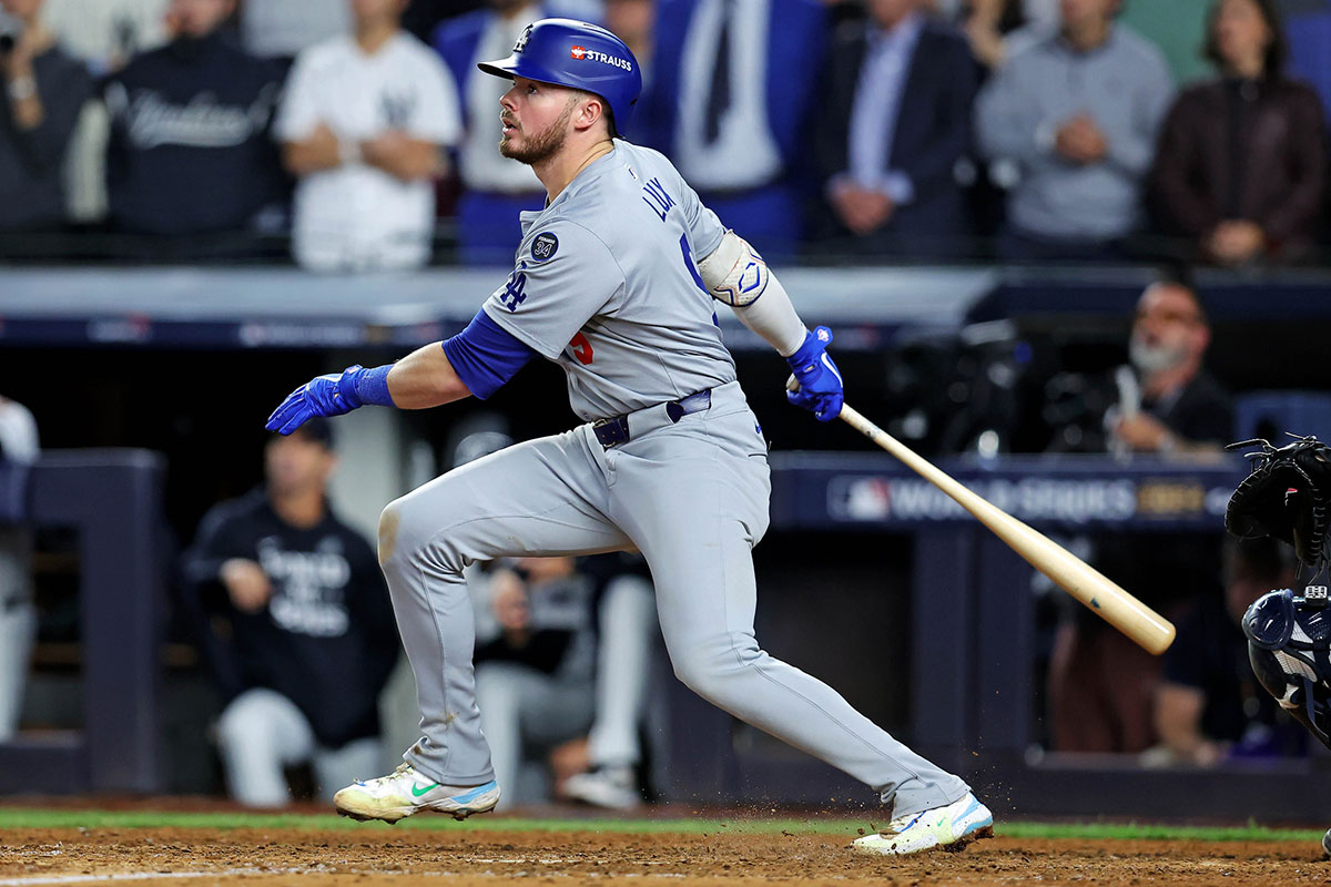 Los Angeles Dodgers second baseman Gavin Lux (9) hits a sacrifice fly during the eighth inning against the New York Yankees in game four of the 2024 MLB World Series at Yankee Stadium.