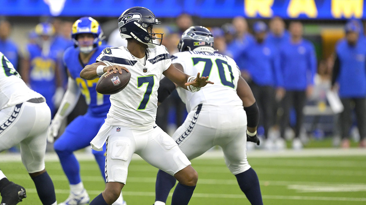 Jan 5, 2025; Inglewood, California, USA; Seattle Seahawks quarterback Geno Smith (7) sets to pass against the Los Angeles Rams in the first half at SoFi Stadium.