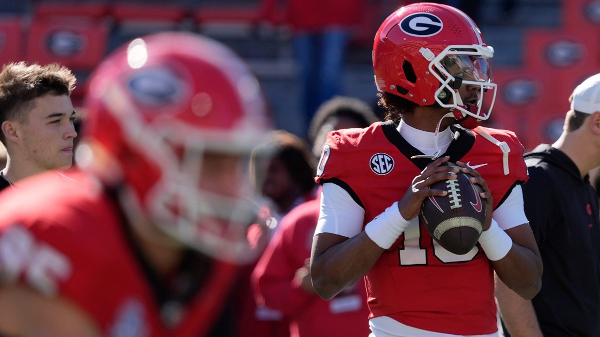 Georgia quarterback Jaden Rashada (10) warms up before the start of a NCAA college football game against Massachusetts