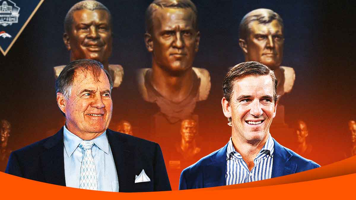 Bill and Eli standing in front of HOF head busts