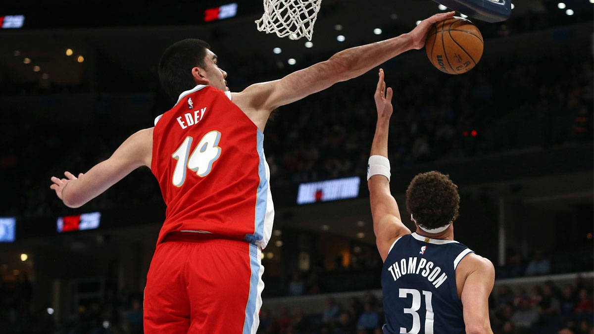 Memphis Grizzlies center Zach Edey (14) blocks a shot attempt by Dallas Mavericks guard Klay Thompson (31) during the first quarter at FedExForum.