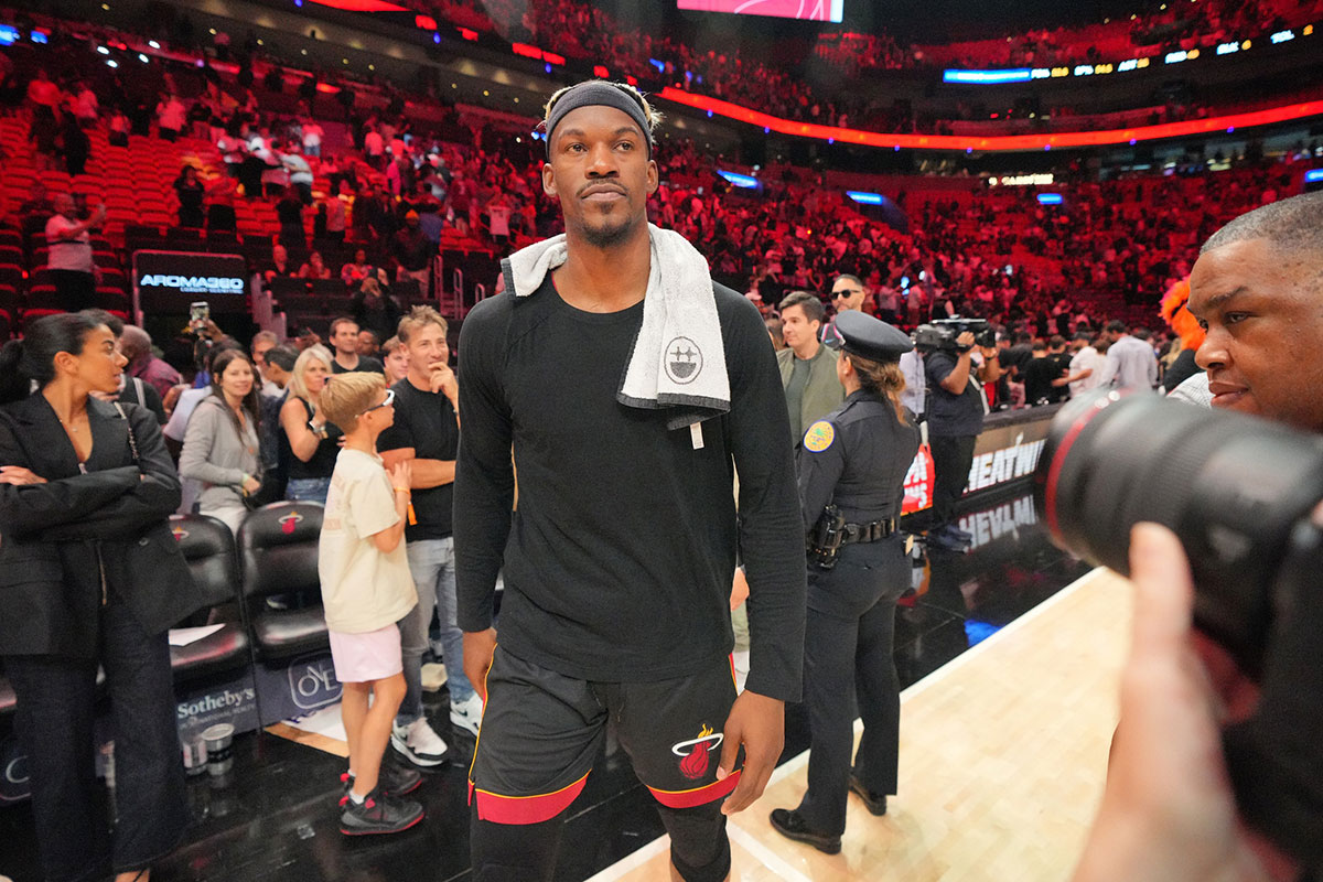 Heat forward Jimmy Butler (22) walks off the court after greeting court-side friends following the victory over the San Antonio Spurs at Kaseya Center