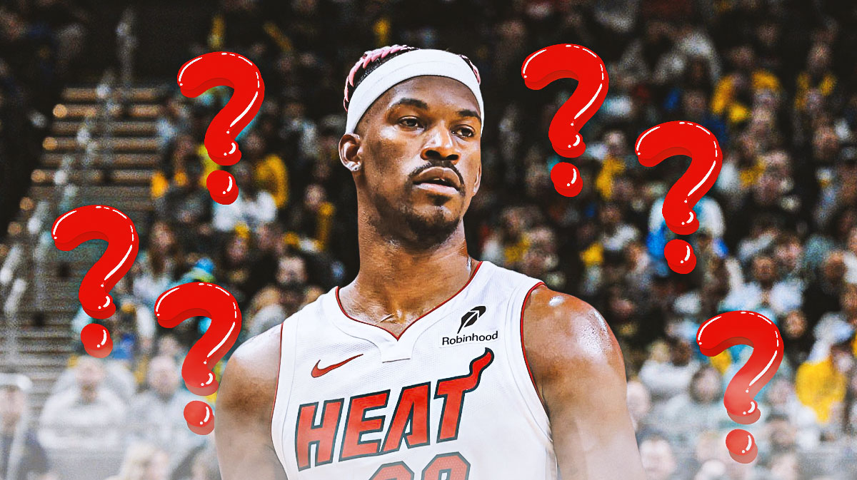 Miami Heat star Jimmy Butler with question marks around him in front of Kaseya Center.