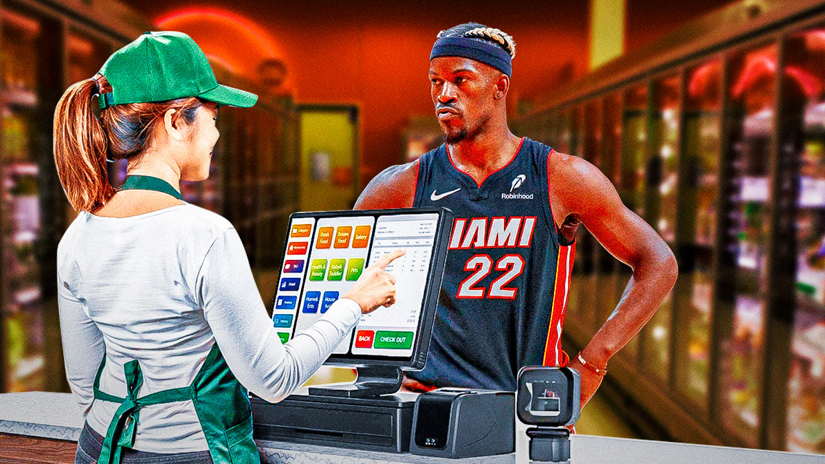 Heat forward Jimmy Butler next to a store cashier with a register in front of him