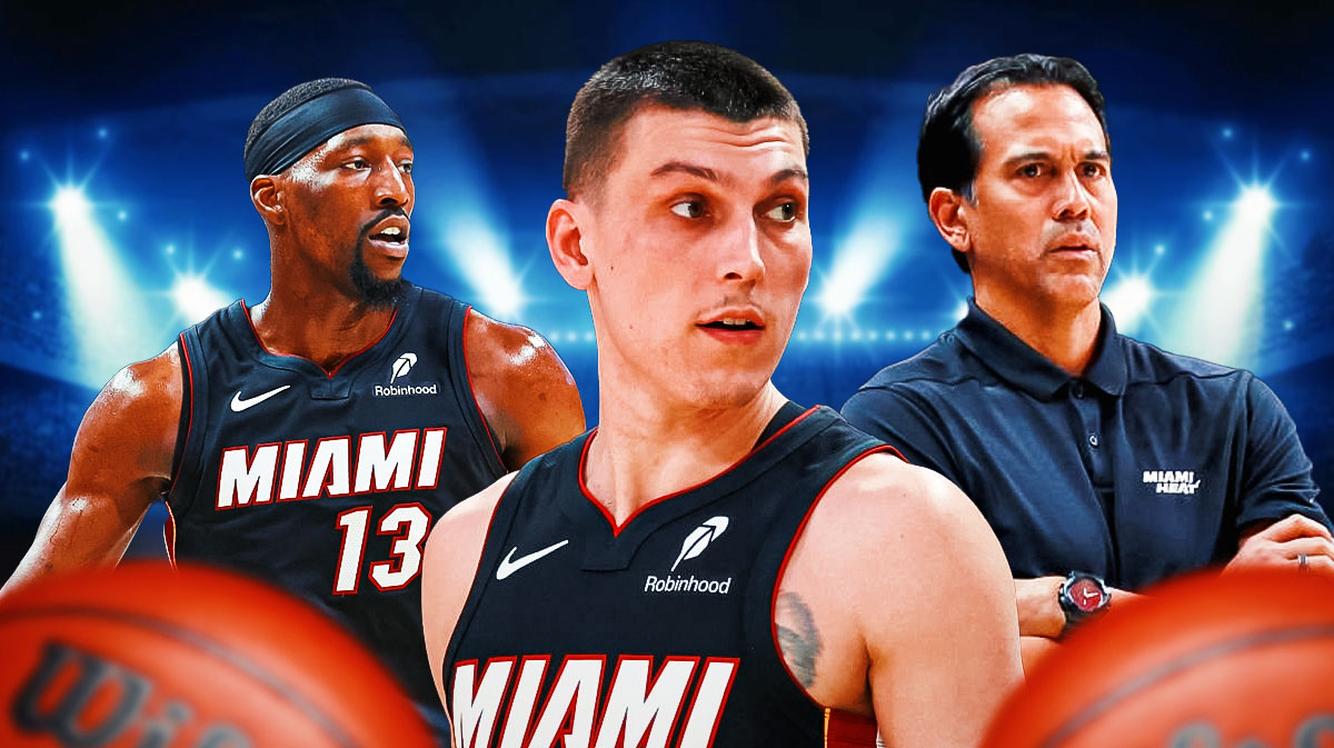 Miami Heat star Tyler Herro in the middle with Erik Spoelstra and Bam Adebayo on either side in front of Kaseya Center.