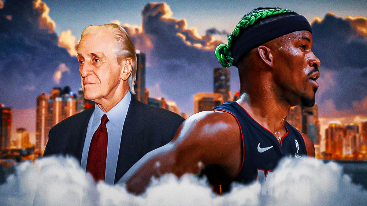 Heat forward Jimmy Butler next to Heat president Pat Riley with the Miami skyline in the background