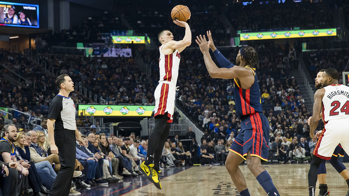 Miami Heat guard Tyler Herro (14) takes a three-point shot against the Golden State Warriors during the first quarter at Chase Center.