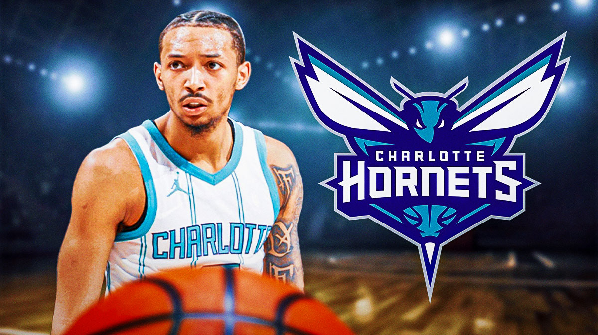 Nick Smith looking confident Charlotte Hornets logo, basketball court in background
