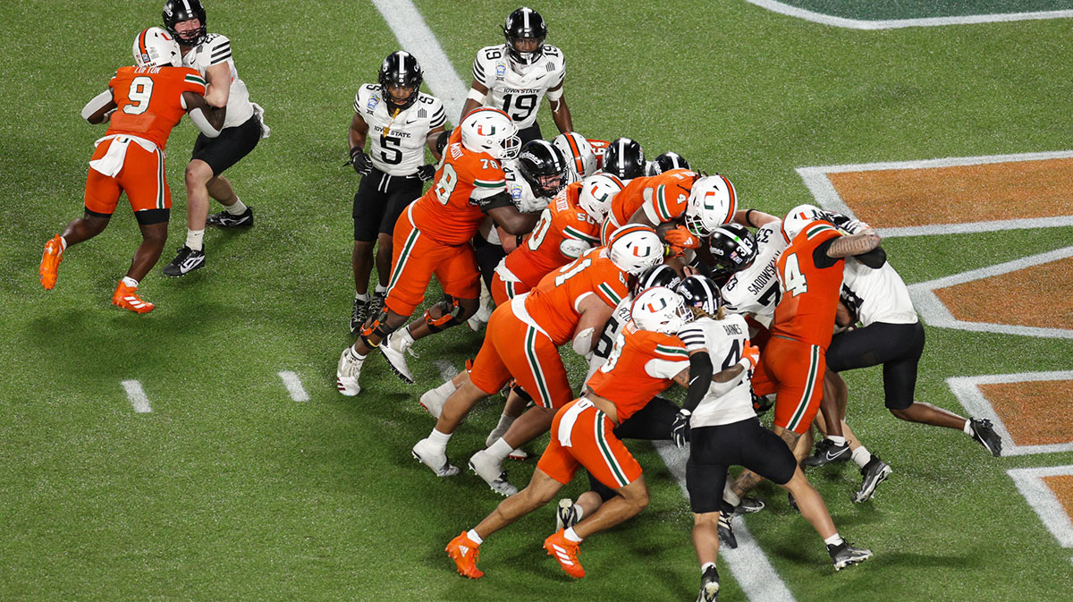 Dec 28, 2024; Orlando, FL, USA; Miami Hurricanes running back Mark Fletcher Jr. (4) scores a touchdown against the Iowa State Cyclones in the third quarter during the Pop Tarts bowl at Camping World Stadium. Mandatory Credit: Nathan Ray Seebeck-Imagn Images