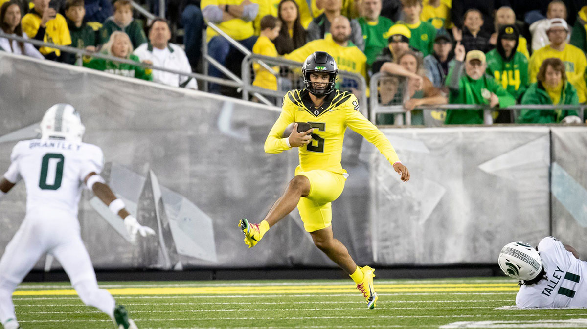 Oregon Ducks quarterback Dante Moore runs the ball as the Ducks host the Spartans Friday, Oct. 4, 2024 at Autzen Stadium in Eugene, Ore.