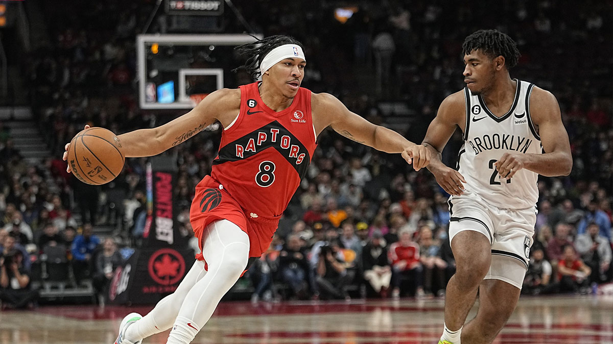 Toronto Raptors guard Ron Harper Jr. (8) drives to the net against Brooklyn Nets guard Cam Thomas (24) during the second half at Scotiabank Arena.