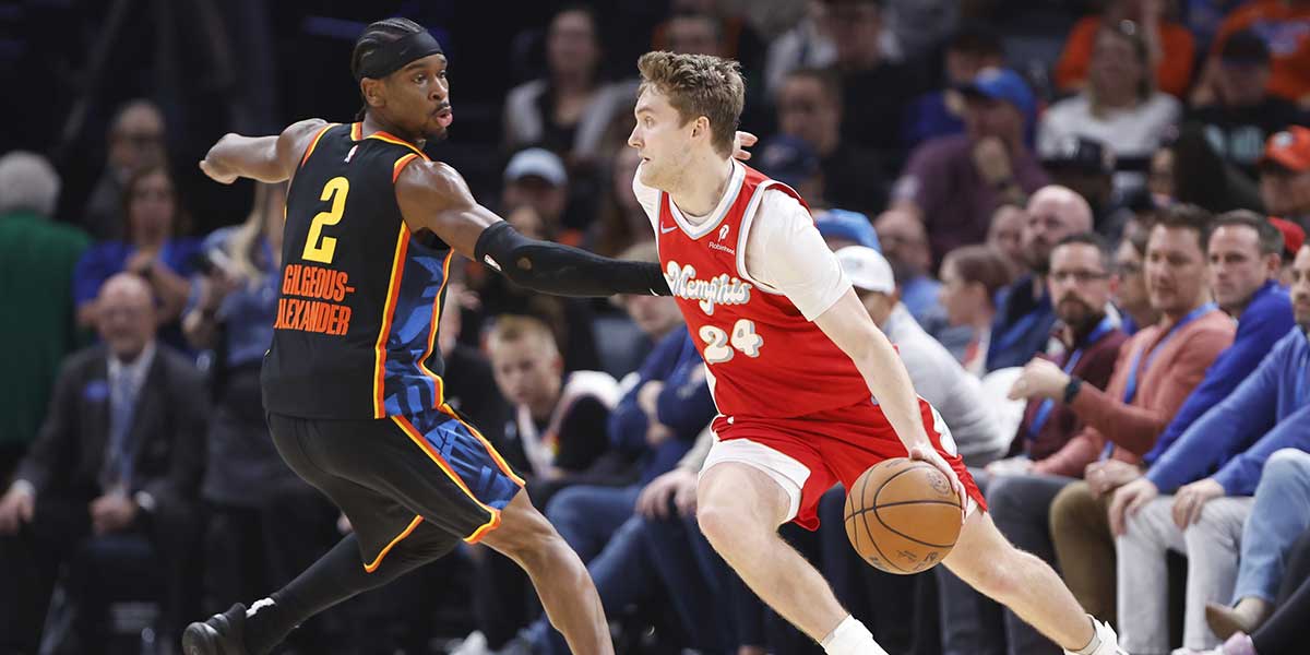 Memphis Grizzlies guard Cam Spencer (24) drives to the basket around Oklahoma City Thunder guard Shai Gilgeous-Alexander (2) during the second quarter at Paycom Center.