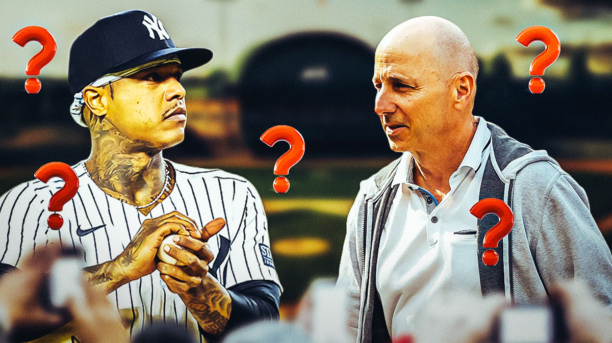 Yankees’ Marcus Stroman standing next to Brian Cashman with question makes surrounding them