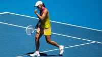 Iga Swiatek of Poland celebrates during her match against Emma Raducanu of United Kingdom in the third round of the women's singles at the 2025 Australian Open