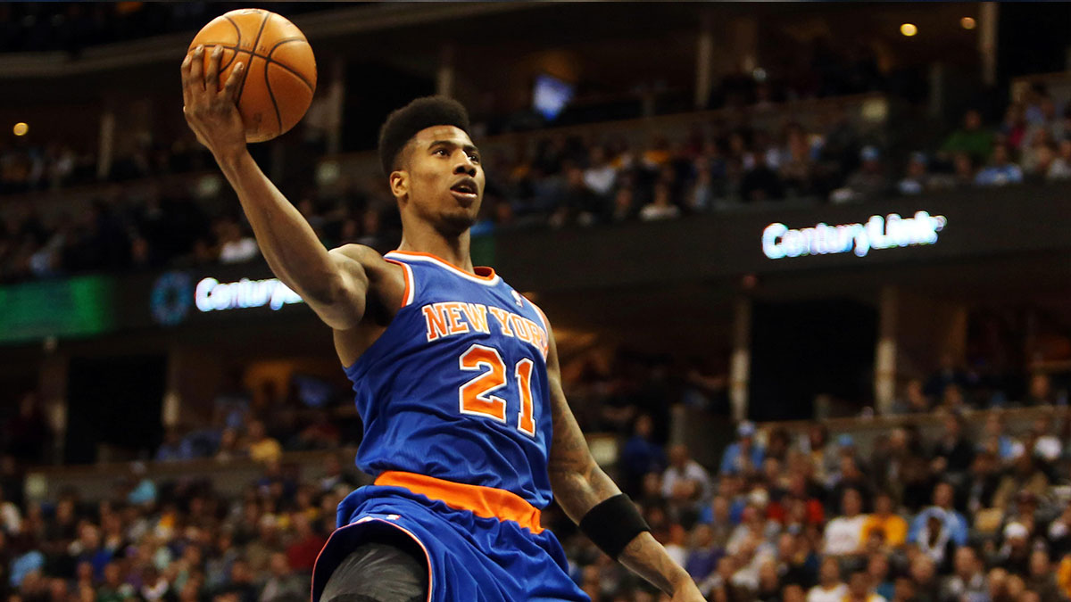 New York Knicks forward Iman Shumpert (21) drives to the basket during the second half against the Denver Nuggets at the Pepsi Center. The Nuggets won 117-94.