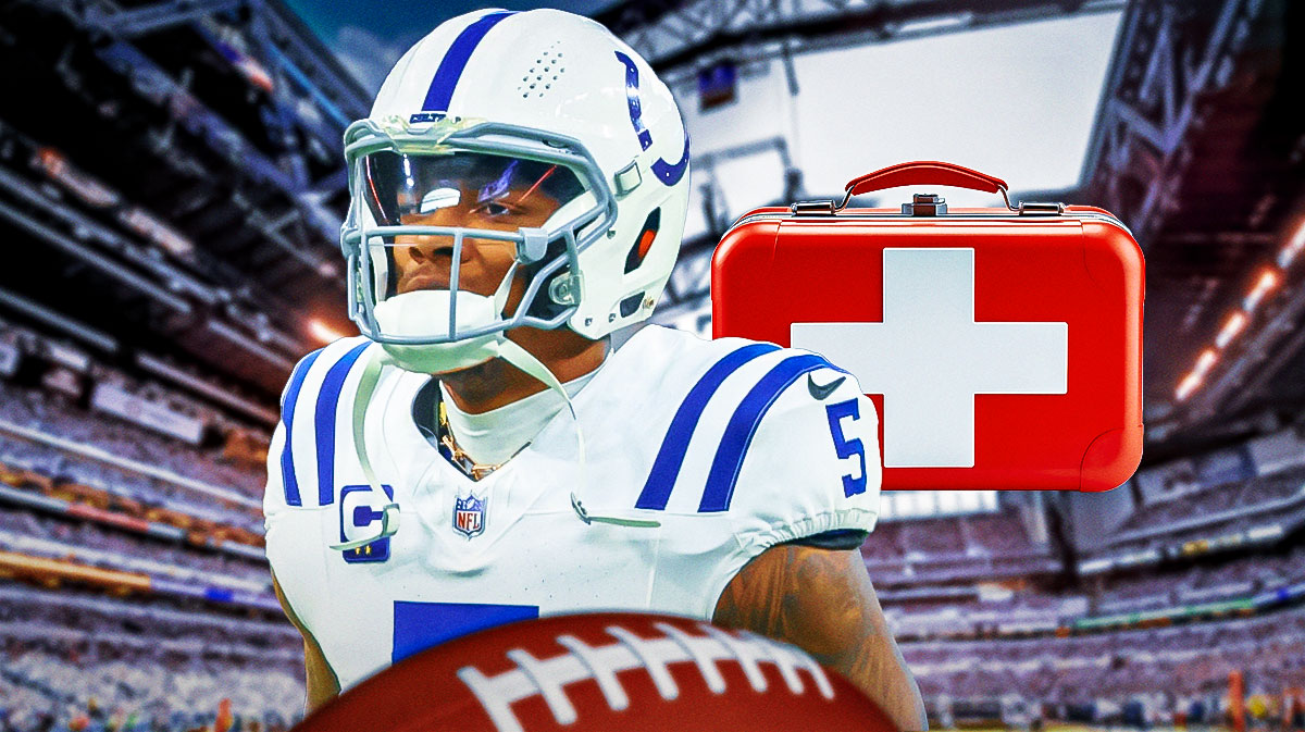 Colts QB Anthony Richardson, medical kit next to him, Lucas Oil Stadium in back