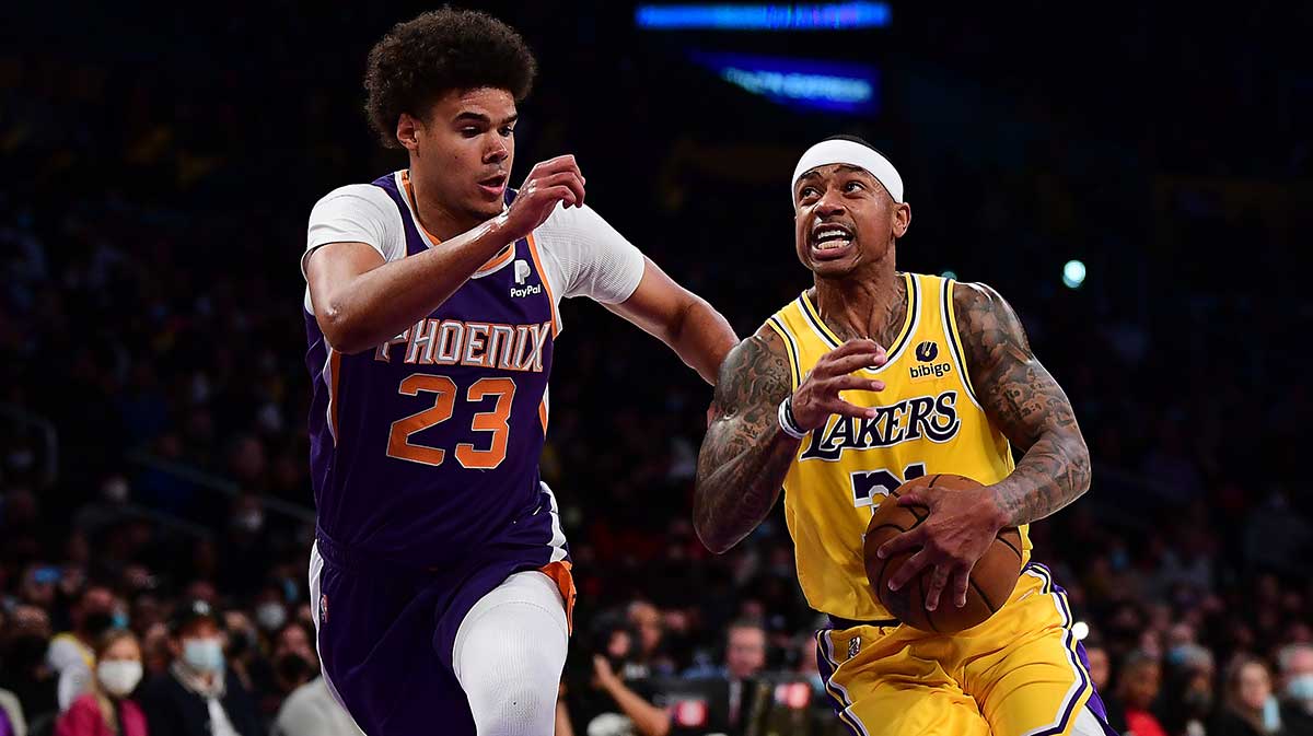 Los Angeles Lakers guard Isaiah Thomas (31) moves the ball against Phoenix Suns forward Cameron Johnson (23) during the first half at Staples Center.
