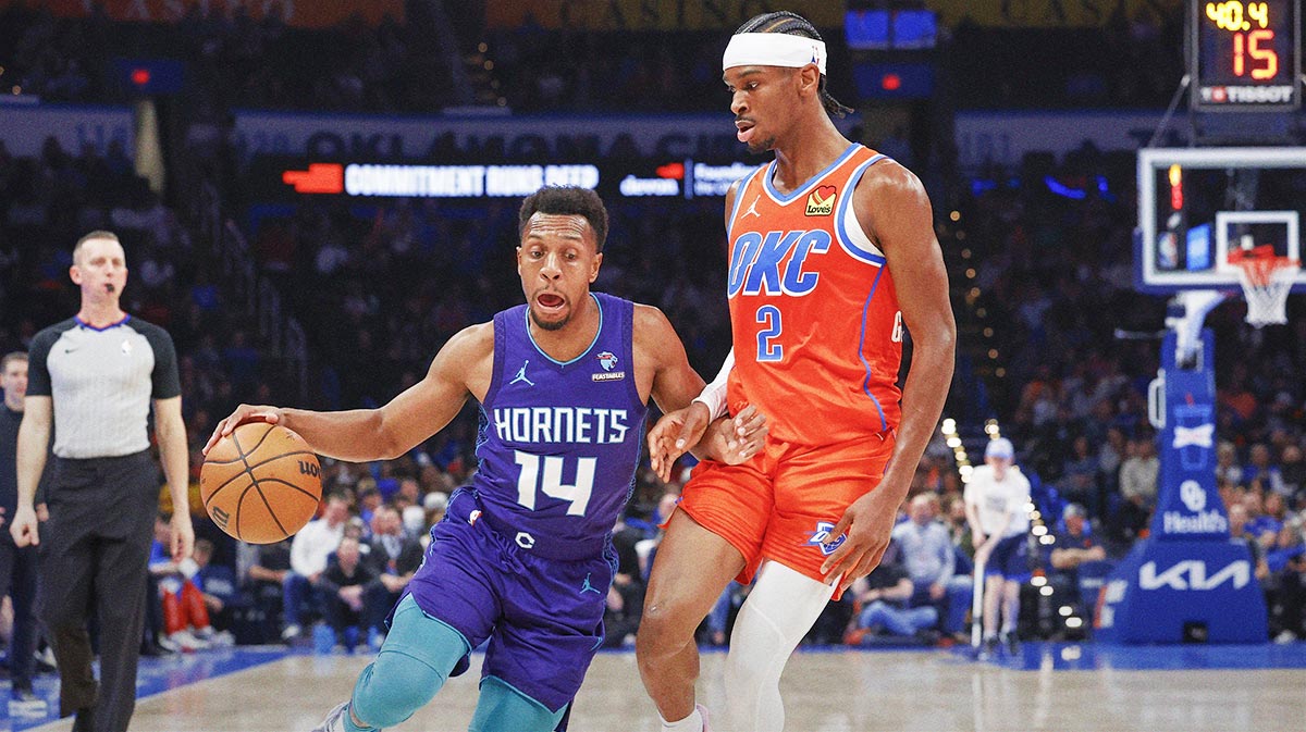 Feb 2, 2024; Oklahoma City, Oklahoma, USA; Charlotte Hornets guard Ish Smith (14) moves around Oklahoma City Thunder guard Shai Gilgeous-Alexander (2) during the second half at Paycom Center.