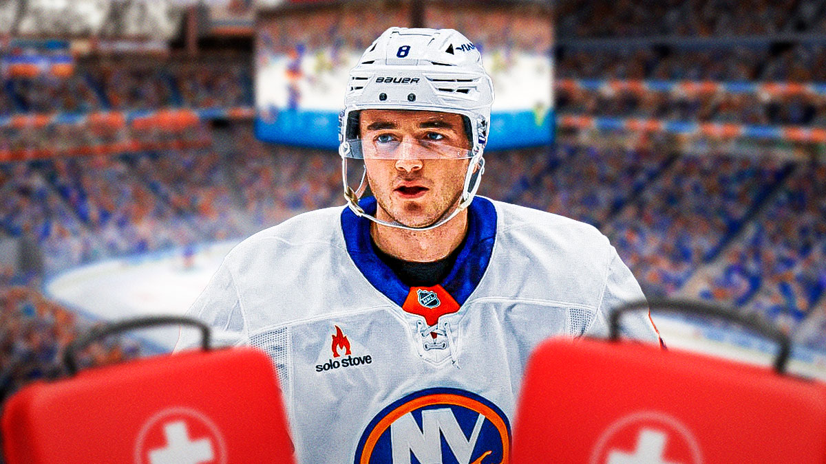 Noah Dobson looking stern, first aid kit, hockey rink in background New York Islanders