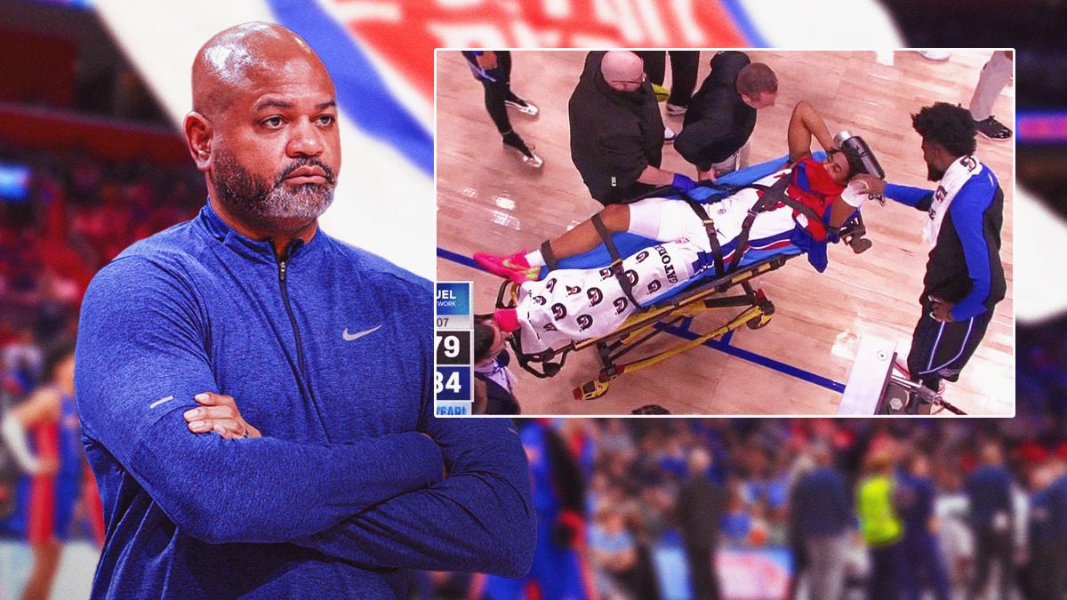 JB Bickerstaff looking at screenshot of Jaden Ivey being stretchered of the court.